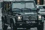 Professional chauffeur service with a black luxury vehicle